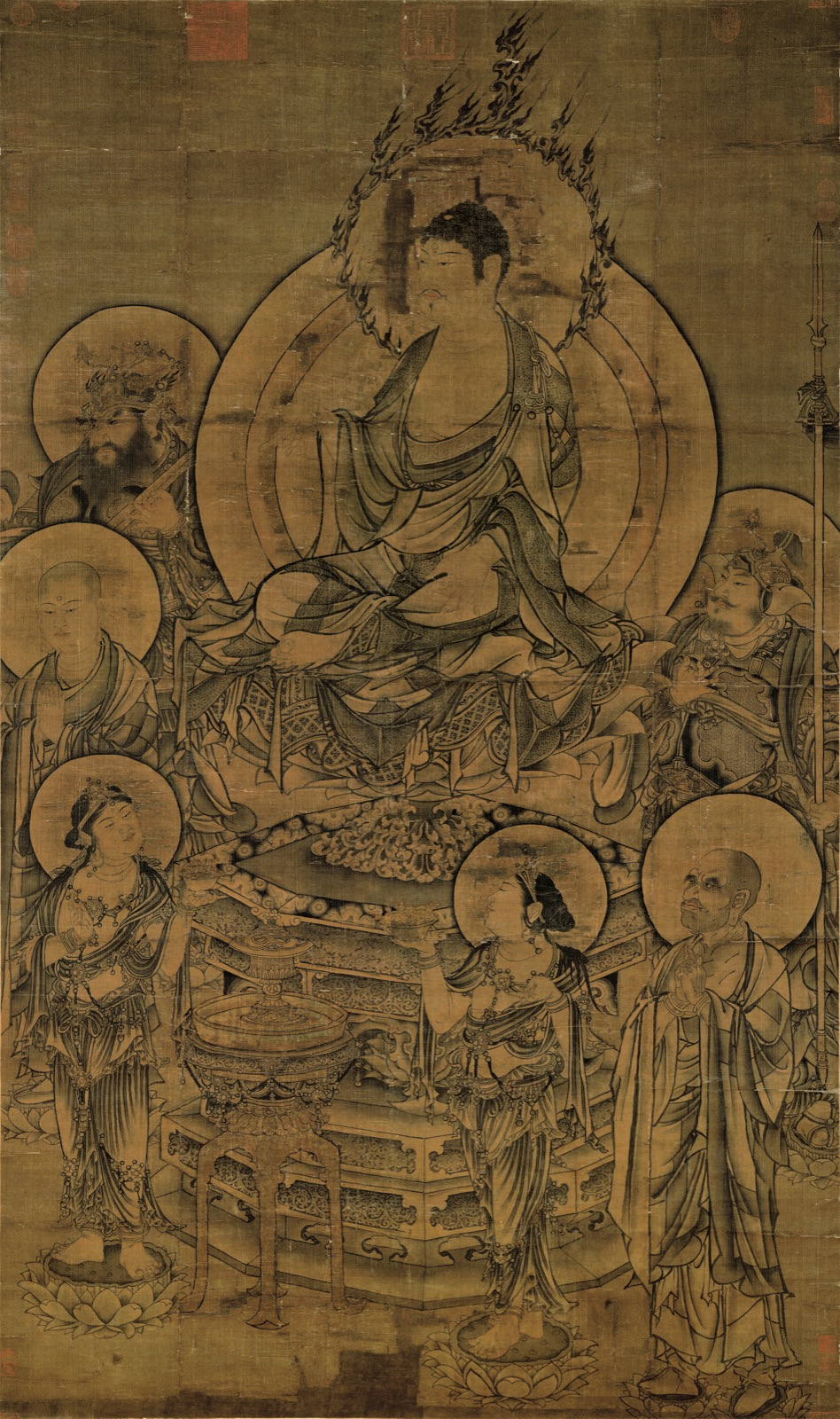 Seated Buddha preaching within a haloed assembly of monks, jeweled attendants, and guardian figures — TK0225