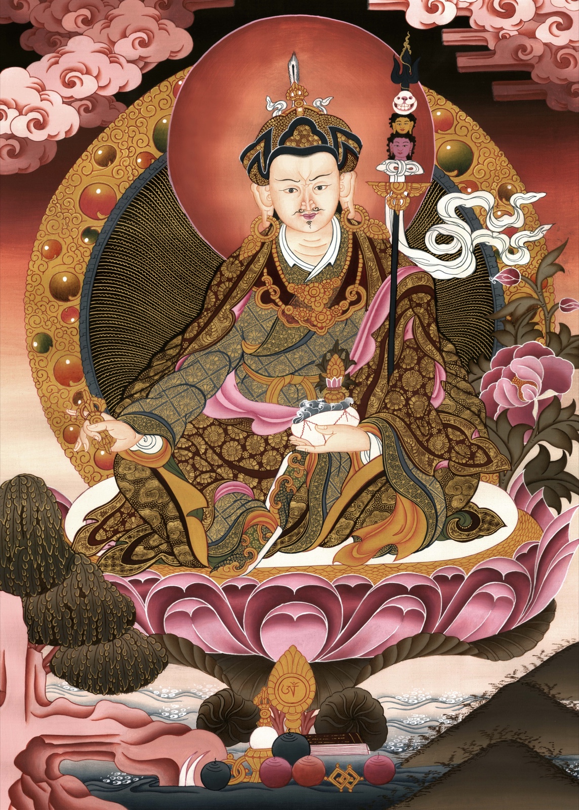 Ornately robed seated Buddhist teacher holding a white vessel beside a tall staff with three faces, skull finial, pink lotus, halo, and offerings — TK0538