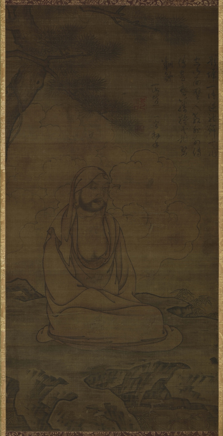 Bodhidharma seated cross-legged beneath a pine tree in a dark ink painting with an inscription at upper right — TK0668